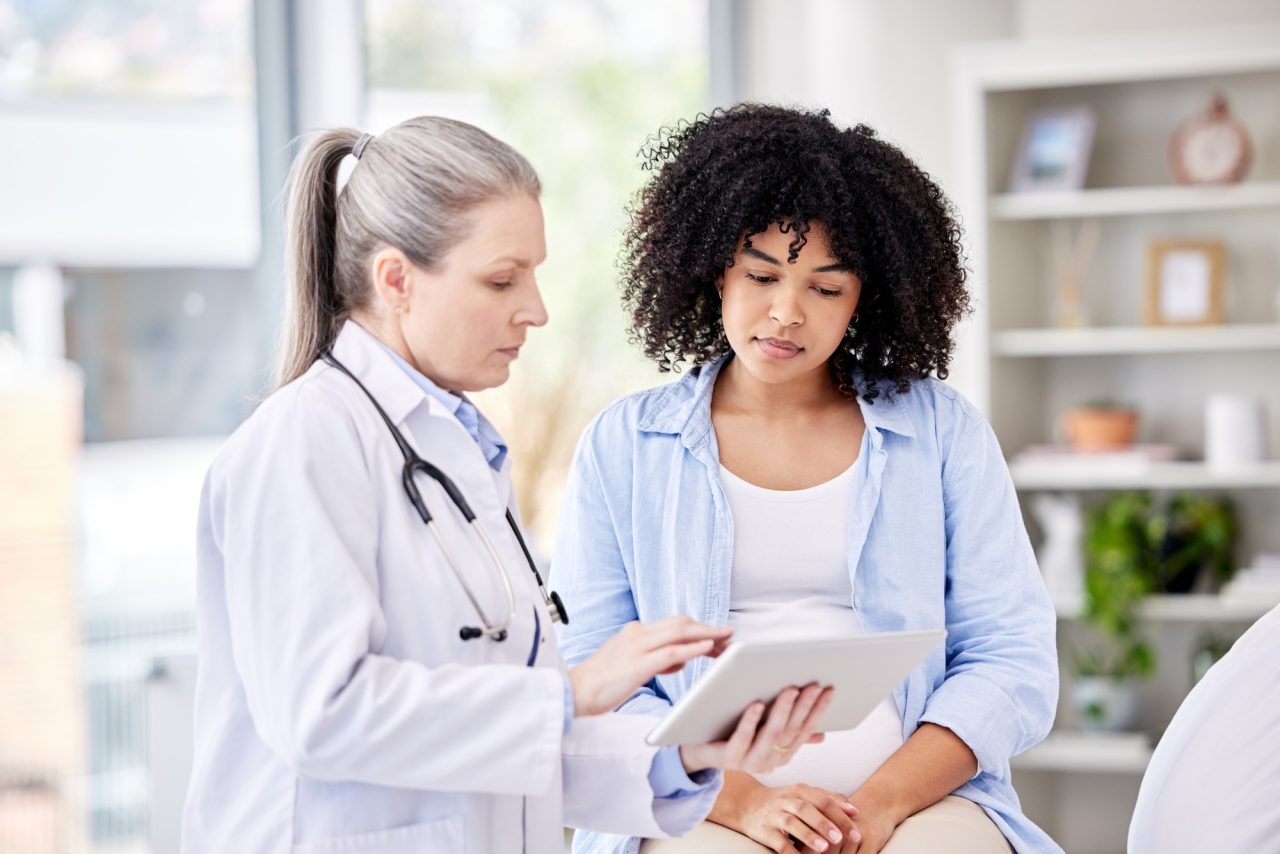 Youre as fit as a fiddle shot of a dentist and a patient using a tablet in a office .jpg